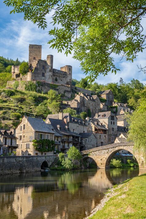 The village of Belcastel, its castle and its medieval bridge, vertical framing - France