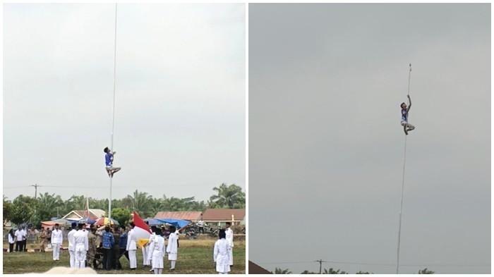 PANJAT TIANG BENDERA - Seorang pemuda Desa Karang Anyar yang diketahui bernama Rizki ketika memanjat tiang bendera setinggi 12 meter untuk memperbaiki tali yang keluar dari rel agar Sang Merah Putih bisa berkibar saat upacara HUT ke 81 Kemerdekaan Republik Indonesia di lapangan Desa Karang Anyar Kecamatan Tungkal Ilir, Kabupaten Banyuasin, Senin (17/8/2026) kemarin.