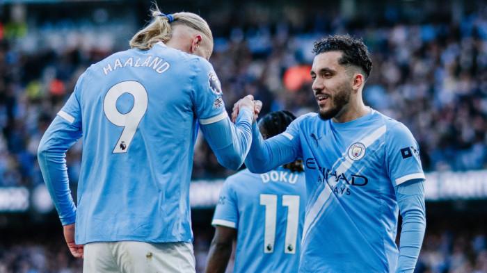 SELEBRASI - Penyerang Manchester City, Erling Haaland (kiri) bersama Rayan Cherki (kanan) melakukan selebrasi bersama setelah menjebol gawang Arsenal dalam pertandingan pekan ke-33 Liga Inggris di Etihad Stadium, Minggu (19/4/2026) malam WIB. Manchester City berhasil menang 2-1.