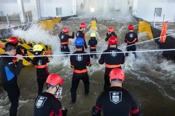 Participants during a typhoon survival training session at the Lvxing Disaster Simulation Training Center in Hangzhou, Zhejiang province, China. Photo by REUTERS.
