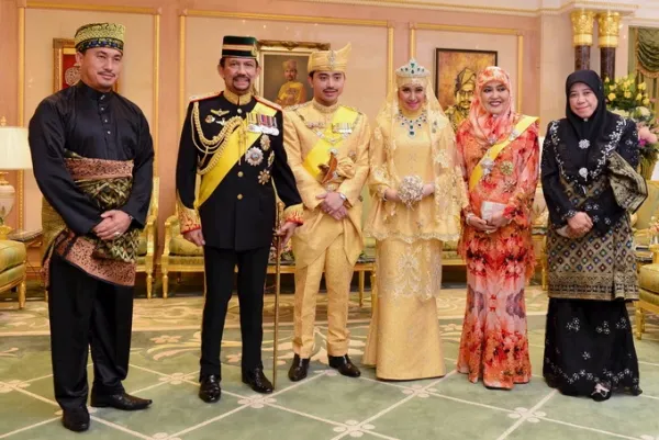 King Hassanal Bolkiah (second from left) photographed with Prince Abdul Malik and his wife at their wedding in 2015. Photo: Reuters