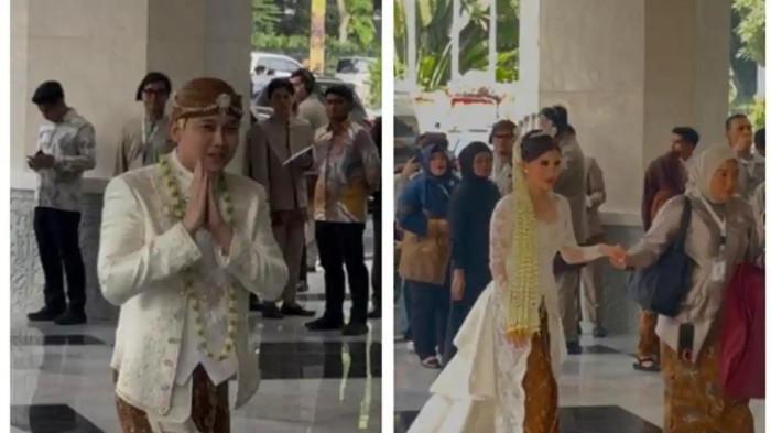 PERNIKAHAN RIZKY IRMANSYAH - Kasespri Presiden Prabowo Subianto, Rizky Irmansyah, memberikan salam hormat saat berjalan di lobi gedung lokasi pernikahannya dengan mengenakan adat Jawa. Sementara itu, calon istrinya berjalan dengan anggun dalam balutan kebaya putih dan sanggul Jawa.
