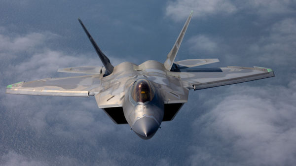 An F-22 Raptor photographed from another aircraft