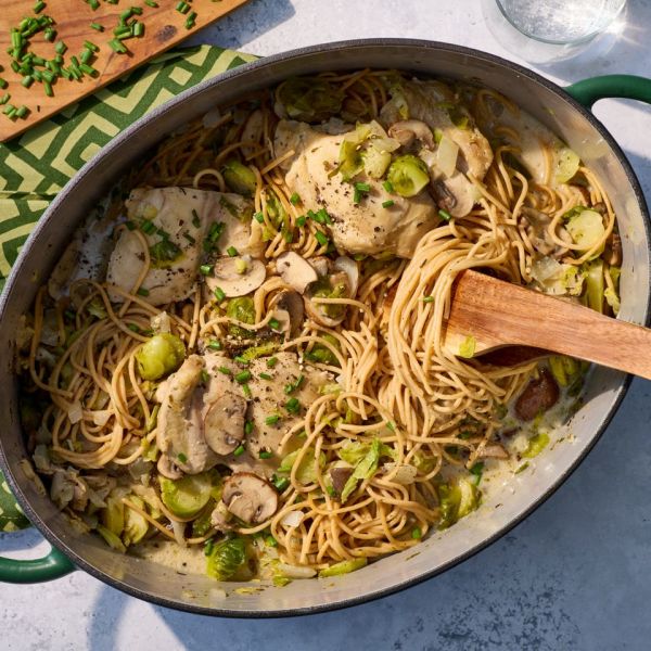 an image of the Creamy Chicken, Brussels Sprouts & Mushrooms One-Pot Pasta Credit: Photographer: Jake Sternquist, Food Stylist: Holly Dreesman, Prop Stylist: Natalie Ghazali