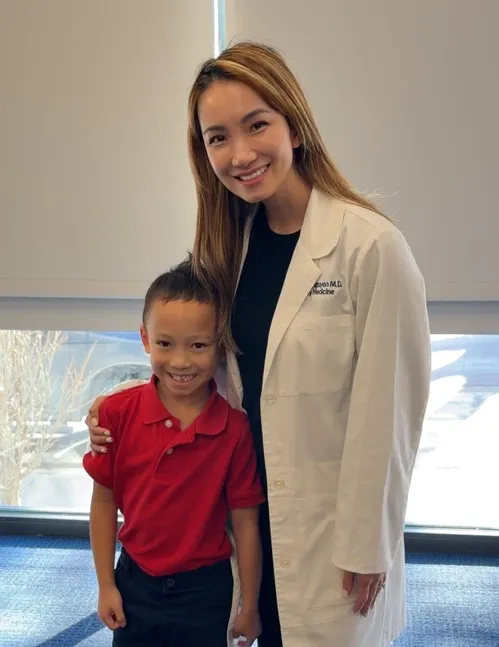 Doctor Christina and her son Henry Hoang at a career orientation day at school. Photo: Provided by the character