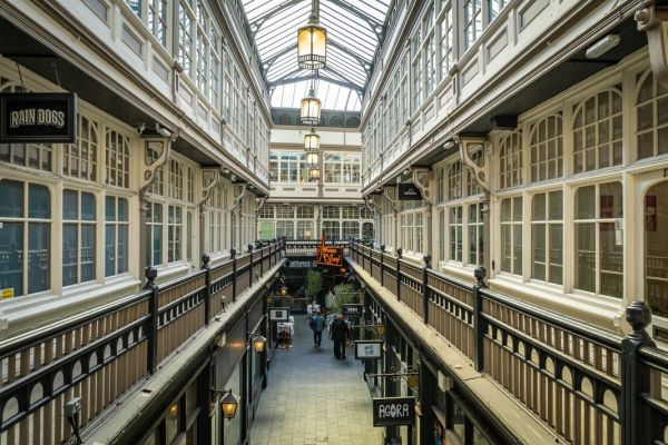 Shops and restaurants in a Victorian covered arcade in Cardiff