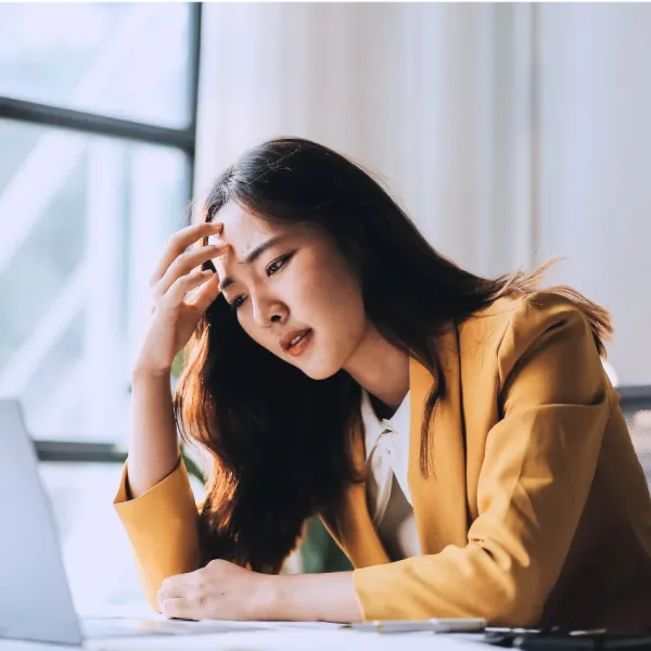 sad woman struggling to make decisions at work
