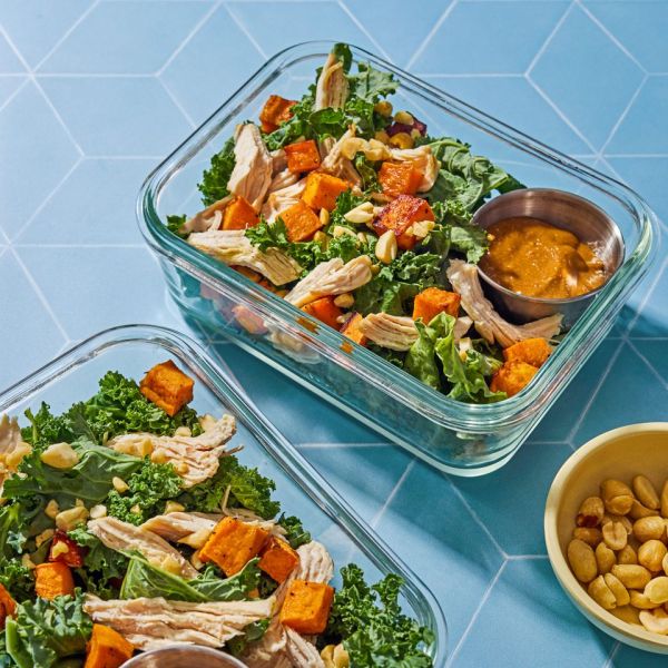 Image of Sweet Potato, Kale & Chicken Salad with Peanut Dressing in portable glass container Credit: Ali Redmond