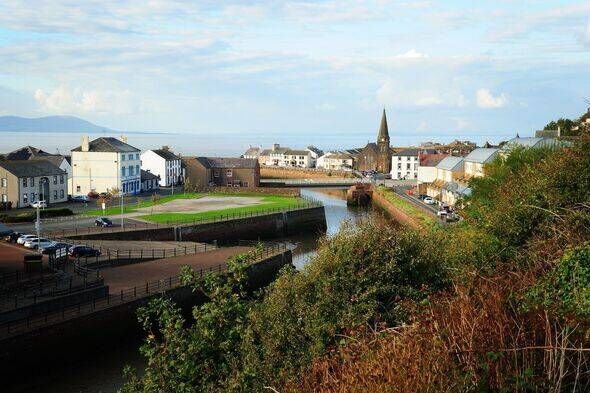 Maryport, Cumbria in England, with a seascape and a mountain in the background on a sunny day Maryport, Cumbria in England, with a seascape and a mountain in the background on a sunny day