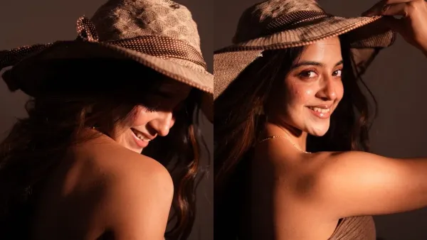 In this picture, Khushi Dubey is wearing a brown strapless, textured corset style top and blue jeans. This combination of brown and blue is simple as well as stylish.