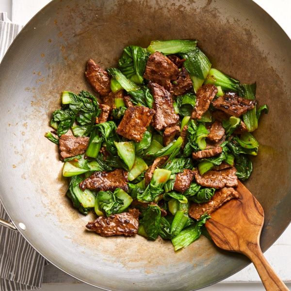Beef Stir-Fry with Baby Bok Choy & Ginger in a wok Credit: Blaine Moats