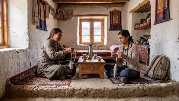 An elderly local woman and a young female traveler spin wool inside a cozy, traditional Himalayan homestay room.