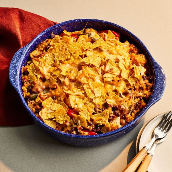 a recipe photo of the Nacho Cauliflower Casserole served in a dish Credit: Photographer: Victor Protasio, Food Stylist: Ruth Blackburn, Prop Stylist: Josh Hoggle