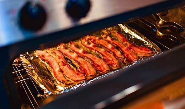 Picture of bacon being placed in the oven Picture of bacon being placed in the oven