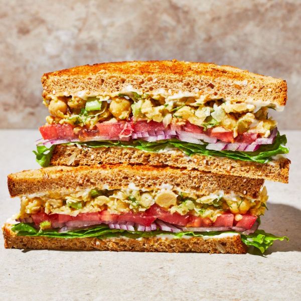 The chickpea salad sandwich recipe, cut in half so you can see the layers of filling Credit: Photographer: Caitlin Bensel, Food Stylist: Ruth Blackburn